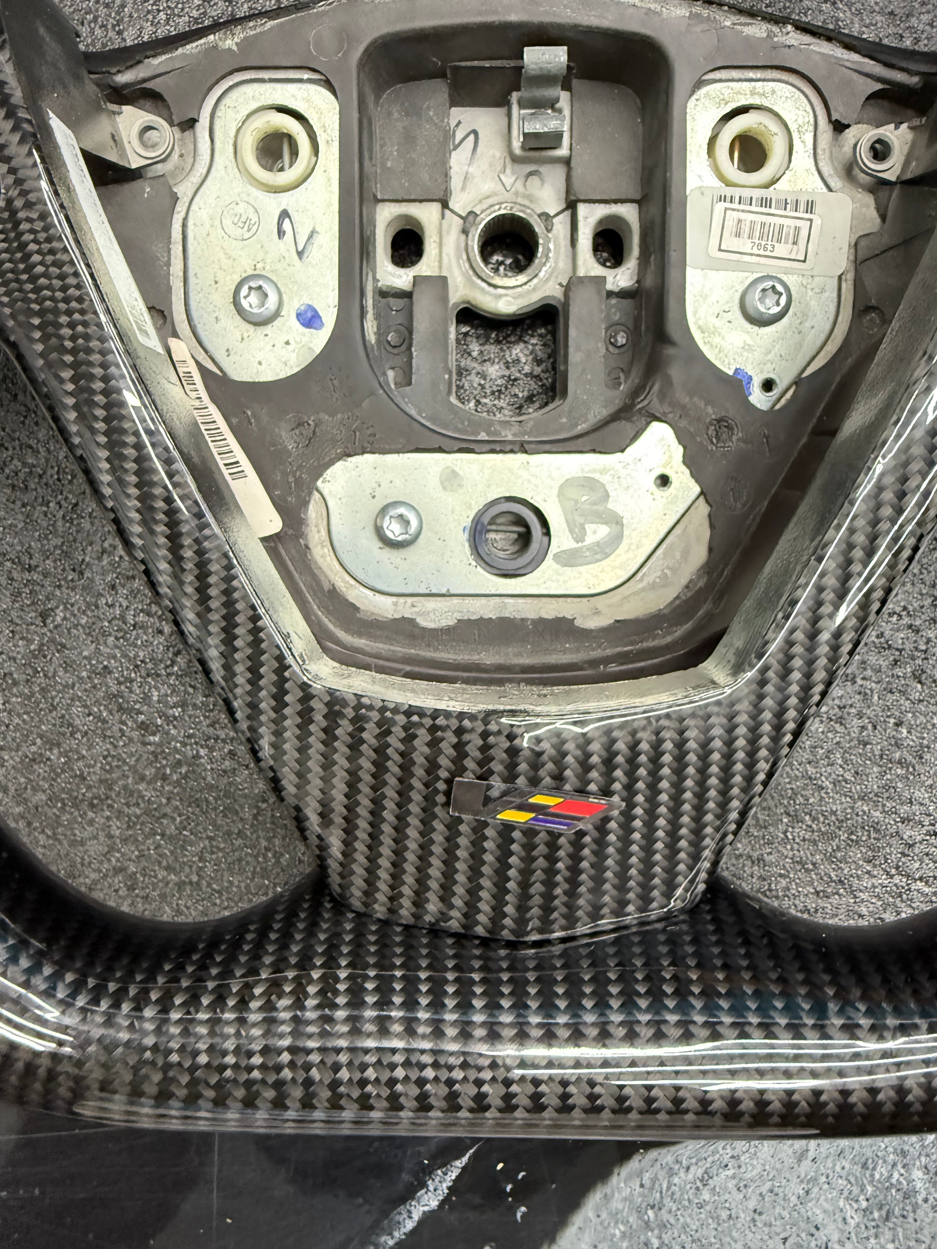 2003 - 2008 CTS, CTS-V V1 Custom Carbon Fiber Steering Wheel with Perforated Leather Hand Grips / Leather Rear Cover